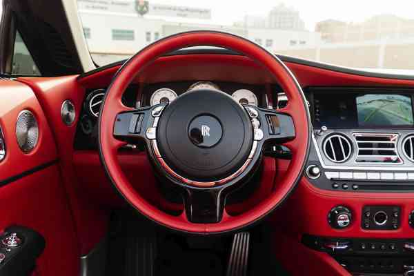 Unique Rolls Royce Dawn in red color is available for rent