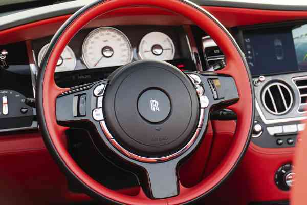 Unique Rolls Royce Dawn in red color is available for rent
