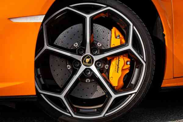 Rent Orange Lamborghini Huracan Evo Spider in Dubai