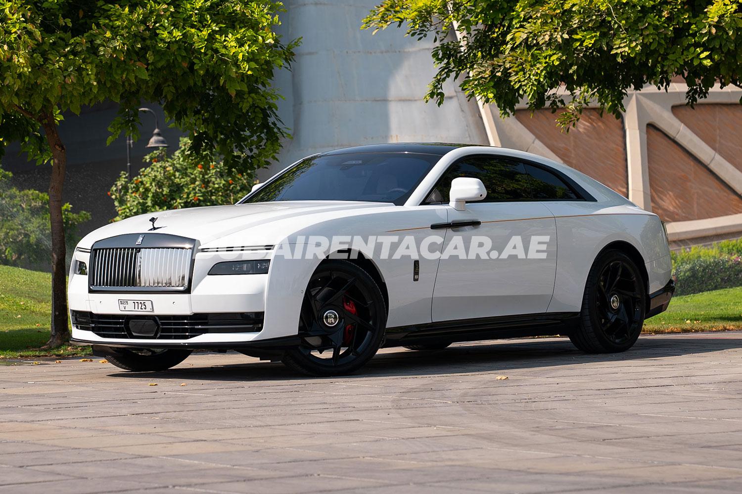 Rent White RR Spectre Black Badge with orange interior in Dubai